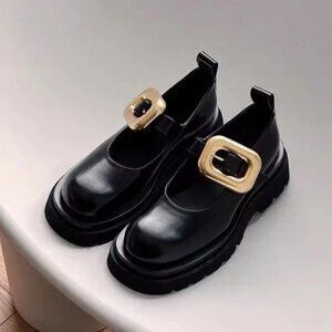 Sleek Black Flats with Gold Accent